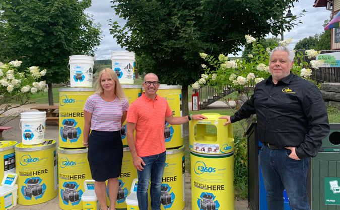 James Ewles and Sarah Lacharity of Environmental 360 Solutions Ltd take a picture alongside John Watson of Dysart et al, unveling new SMART outdoor battery recycling containers.